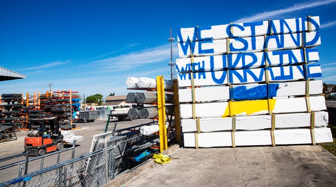 Juan Morales, owner of Western Fence Supply in Fort Myers, painted  a "We stand with Ukraine" sign that stands along Evans Avenue in Fort Myers. He painted the sign earlier this week. Morales said "I think the world should stand against him and unite to fight this bully and bring peace to the country."