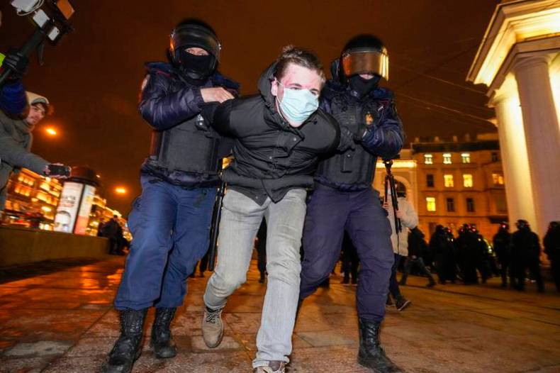 Police detain a demonstrator during an action against Russia's attack on Ukraine in St Petersburg.