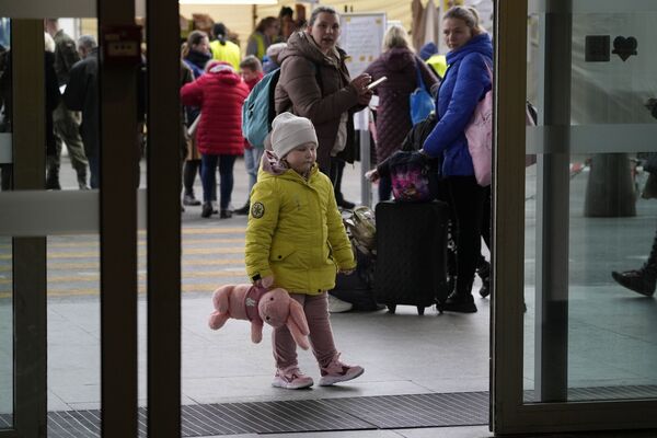 Ukrainian refugees waiting at a central train station in Warsaw, Poland. To each family, it is a personal story but it is also the largest refugee crisis in Europe since the Second World War. Picture: Czarek Sokolowski/AP
