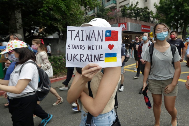 Ukrainian nationals in Taiwan and supporters protest against the invasion of Russia during a march in Taipei.