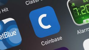 The app for Coinbase (COIN) displayed on an iPhone screen.