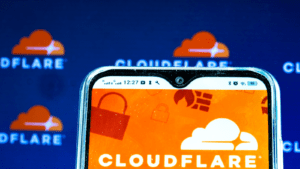 An illustration a Cloudflare (NET) logo is seen displayed on a smartphone