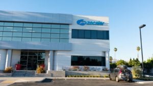 Zscaler (ZS) logo on building with parking lot in foreground
