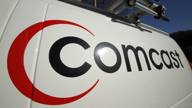 FILE - This Feb. 11, 2011 file photo shows the Comcast logo on one of the company's vehicles, in Pittsburgh. Wall Street appears increasingly convinced Comcast?s $45.2 billion purchase of Time Warner Cable is dead. telling indicator is the gap between the value Comcast?s all-stock bid assigned to each Time Warner Cable share and Time Warner Cable stock?s current price. That was at its widest point yet Thursday, April 23, 2015, a signal that investors are giving just 20 to 30 percent odds that the deal will go through, said Nomura analyst Adam Ilkowitz. (AP Photo/Gene J. Puskar, File)