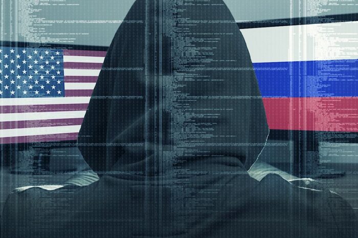Hacker working on a cyber attack on USA and Russia. Concept of hacking into the computer.