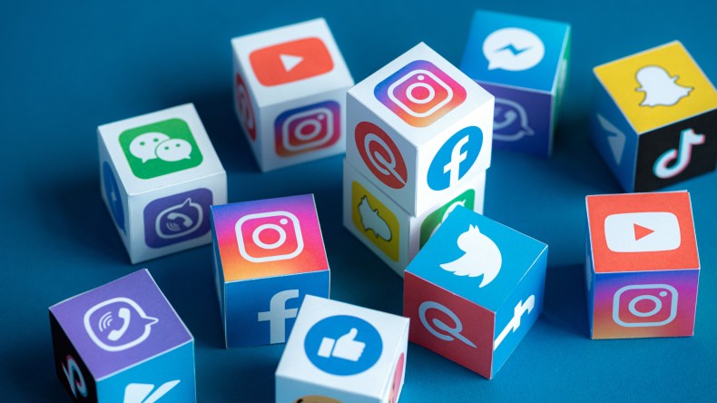 A group of cubes all displaying social media logos