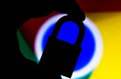 Silhouette of someone holding a padlock in front of the Google Chrome logo