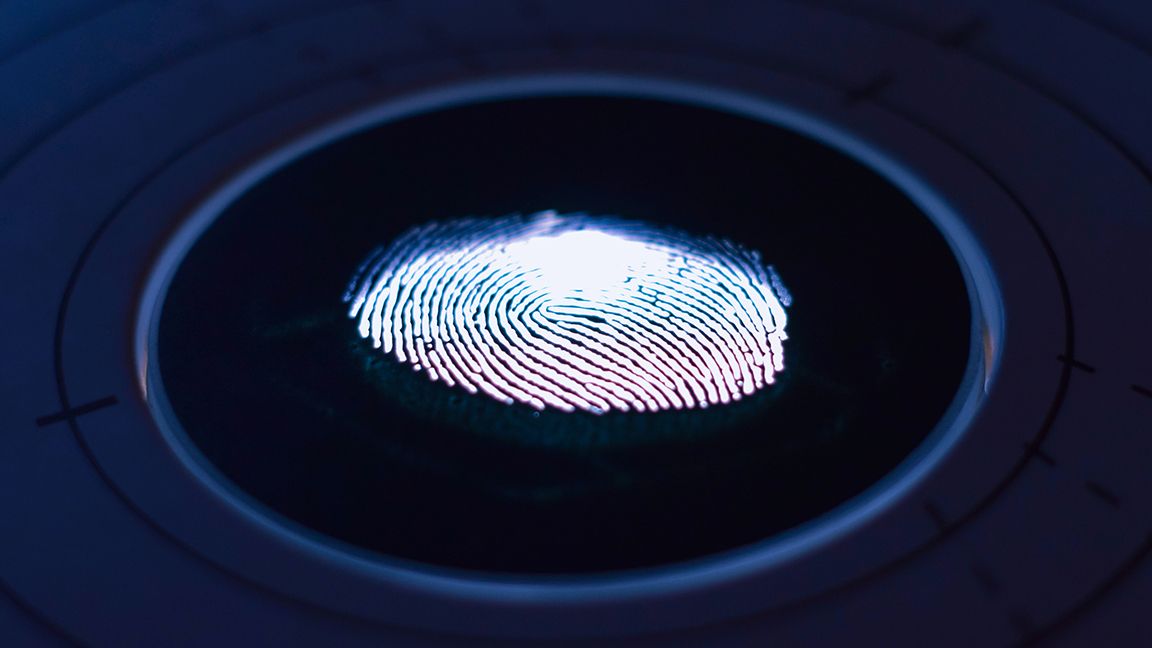 Fingerprint scanner on dark background
