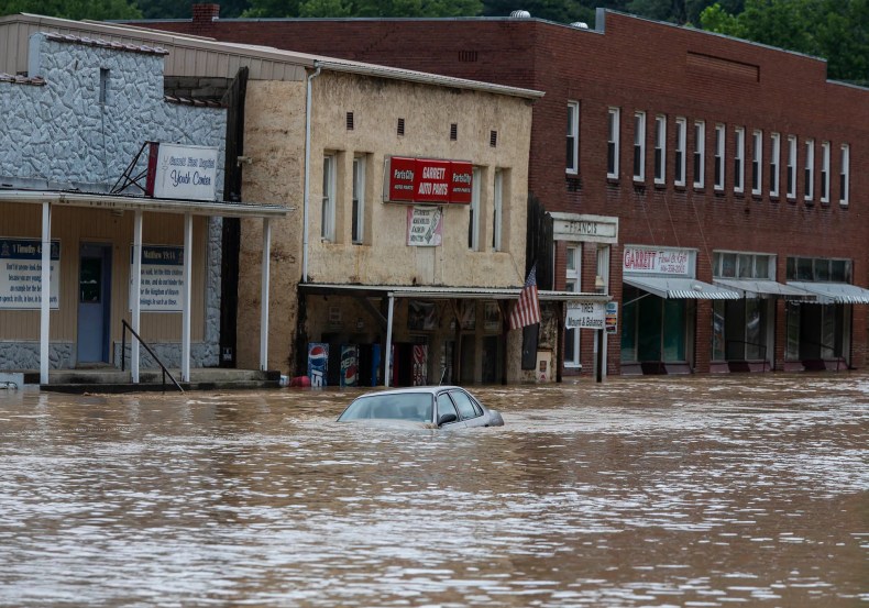 A car is submerged in flood waters along Right Beaver Creek, in Garrett, Kentucky, following a day of heavy rain. July 28, 2022