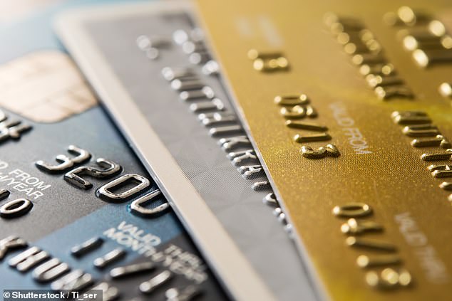 Our 'shocking record' could mean both that Brits do not know how to protect access to their bank accounts and that criminal fraud gangs target the UK more. Pictured: Stock of credit cards