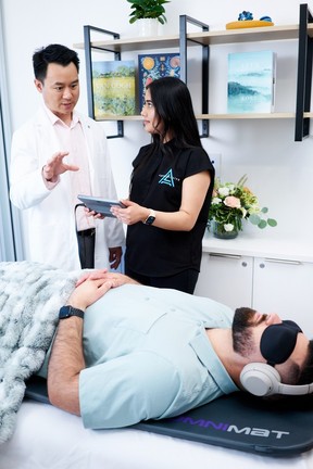 Dr. Jean Paul Lim, MD (at left) oversees a biohacking treatment at Ageless Living.