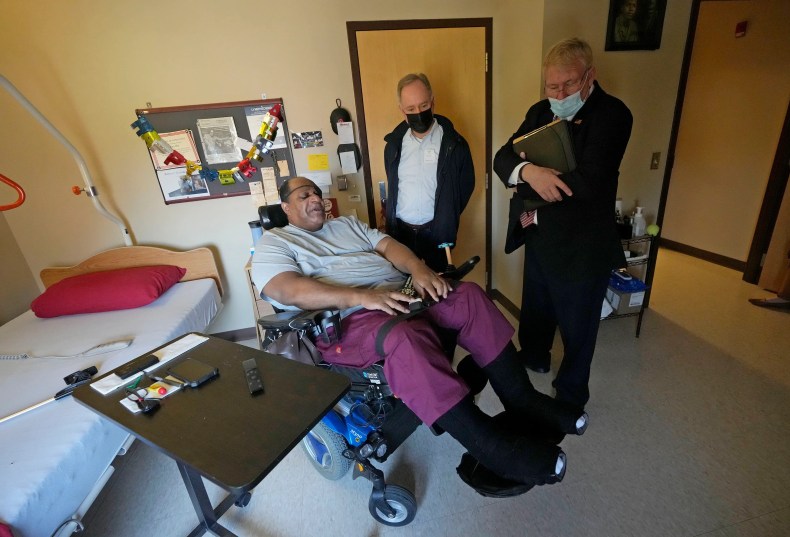 Veteran and resident Kenney Blue talks with Assembly Speaker Robin Vos and Sen. Van Wanggaard in Blue’s room at Wisconsin Veterans Home, Boland Hall, in Union Grove on Monday, May 9, 2022. Van Wanggaard and Vos were there for a tour and to talk to the residents. The facility has a high number of federal deficiencies when compared to other such state veterans nursing homes around the country.