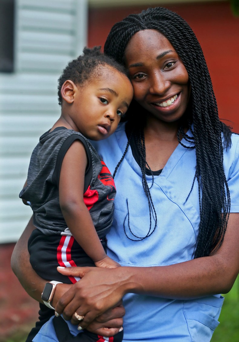 Laketa Watts, director of Essentially Empowered, holds her son Isaiah. Watts created Essentially Empowered, a program that she oversees for asthma prevention in Milwaukee.