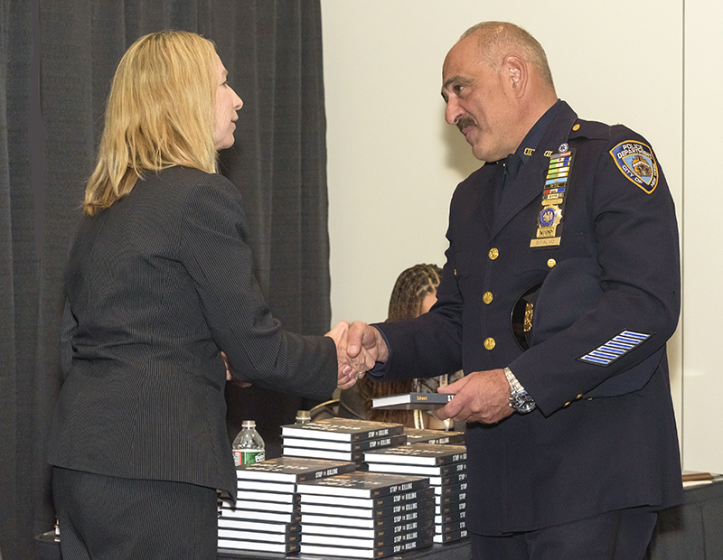 Katherine Schweit, former head of the FBI’s active shooter program speaks with 'ASTORS' Attendees and autographs copies of 'STOP THE KILLING: How to End the Mass Shooting Crisis.'