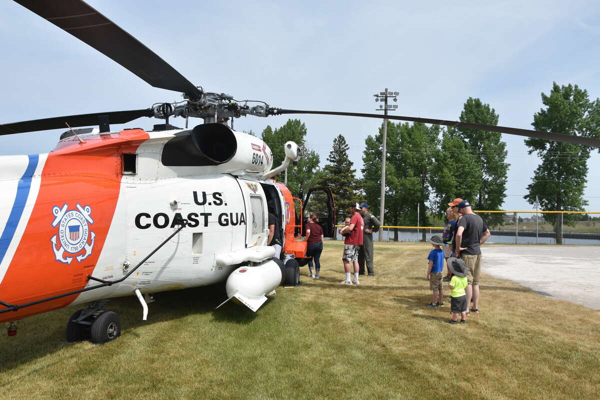 Coast Guard Air Station Traverse City crew members flew to Manistee for the Kid's Safety Day event on June 3, 2023. The helicopter landed at the First Street Beach softball fields where families had a chance to observe and sit inside the aircraft. 