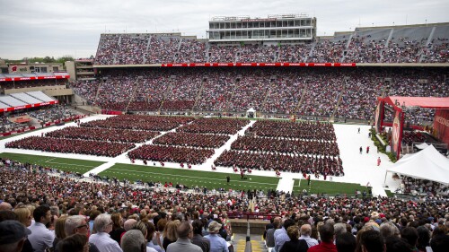 FILE - Attendees watch the 170th University of Wisconsin-Madison commencement ceremony at Camp Randall Stadium in Madison, Wis., on May 13, 2023. Republican lawmakers were poised Tuesday, June 13, to cut funding for University of Wisconsin campuses as the GOP-controlled state Legislature and school officials continue to clash over efforts to promote diversity and inclusion. (Samantha Madar/Wisconsin State Journal via AP, File)