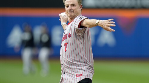 St. John's men's basketball coach Rick Pitino throws out a ceremonial first pitch before a baseball game between the New York Mets and the New York Yankees Tuesday, June 13, 2023, in New York. (AP Photo/Frank Franklin II)