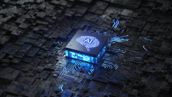 A digital rendering of a circuit board with a chip in the center, with AI inscribed on it