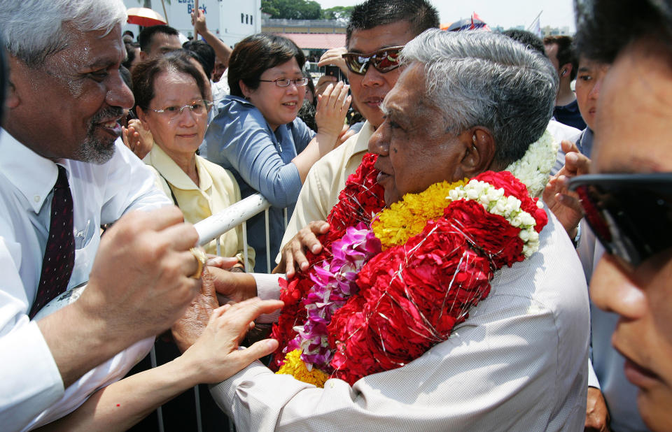 Singapore President S R Nathan is greeted by supporters after his re-election for a second term in 2005. 