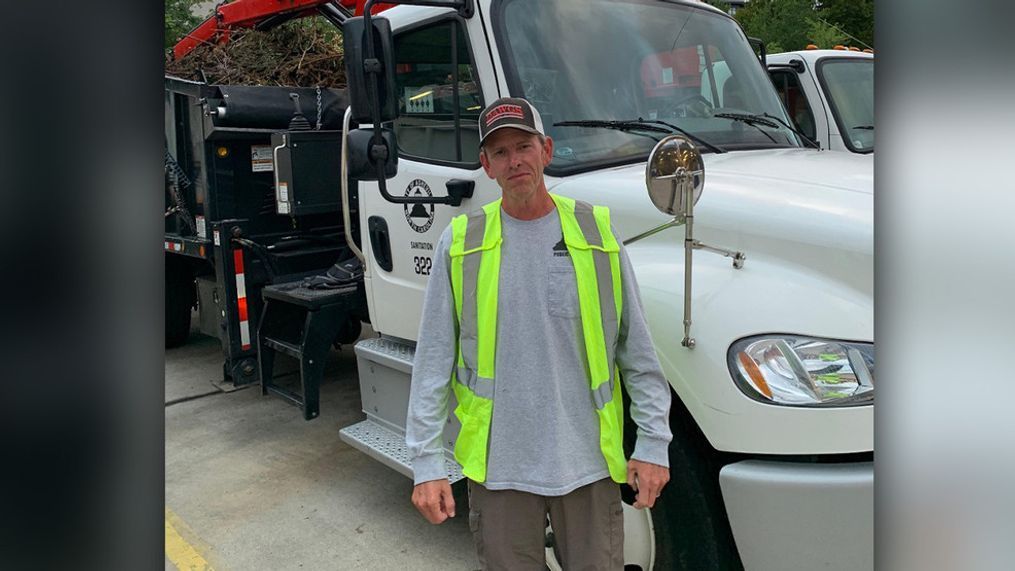 {p}Jon Webb, an Asheville sanitation worker, was recognized by the city for helping an unaccompanied toddler find her way home. (Photo credit: Asheville City Government via Facebook){/p}