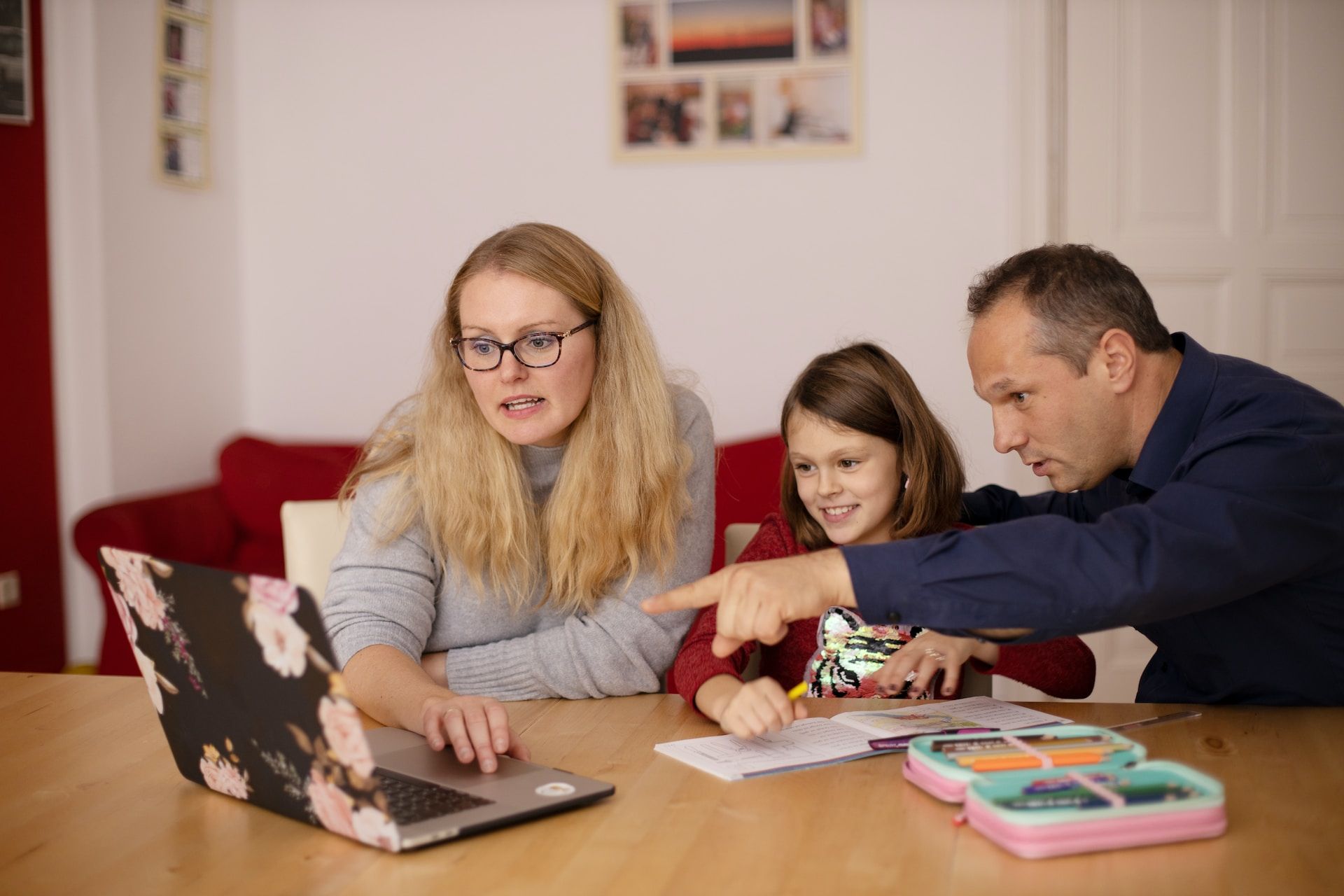 Family of 3 looking at a computer