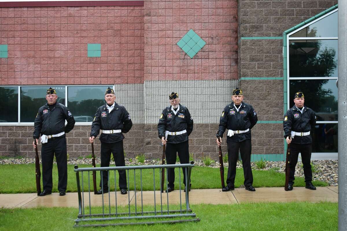 Students from Big Rapids Middle School gathered at the Big Rapids Department Of Public Safety to observe a rifle salute and moments of silence to honor lives lost in 9/11. 