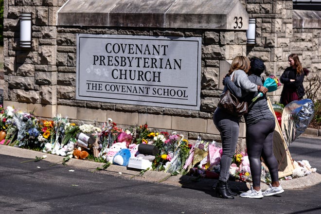 Tributes at the entrance to the Covenant School on March 29, 2023, in Nashville, Tenn., after a former student at the school killed three students and three teachers.
