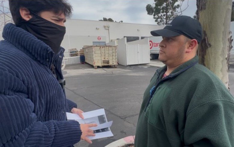 Ghost, left, founder of CC Unit, talks with Adam Escarcega in Goleta on Monday. Shortly after their conversation, Escarcega was arrested by Santa Barbara County sheriff's deputies.