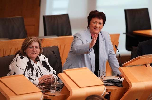 Rona Mackay standing while speaking in Parliament