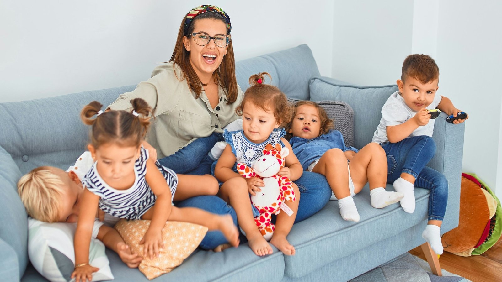Woman on couch with children