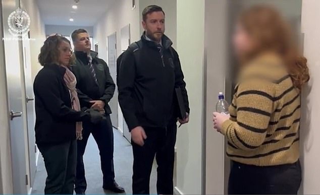 Kingston (far right) has been charged with 20 offences after allegedly hacking the institution