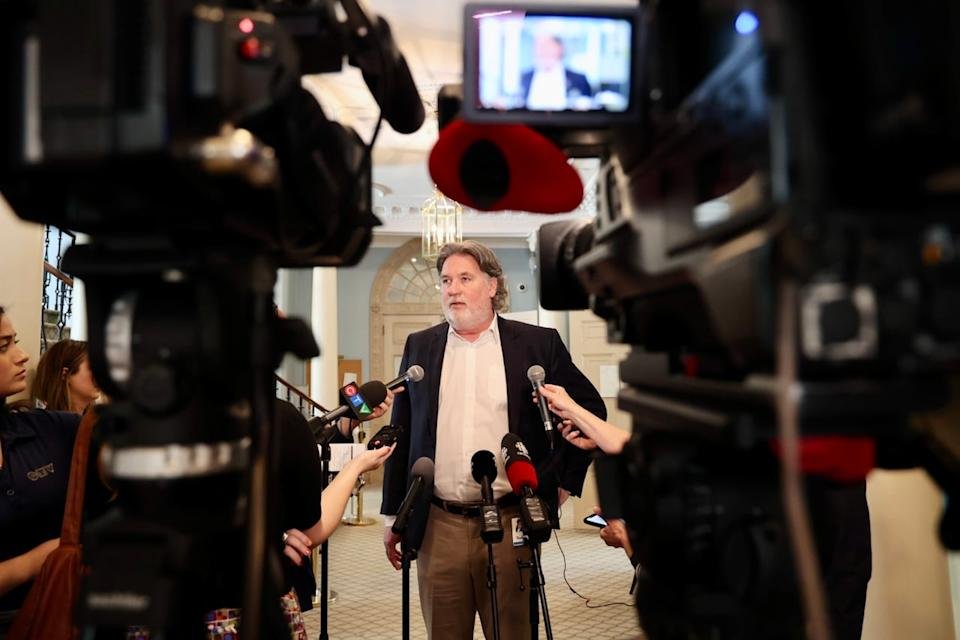 Peter Gregg, the CEO of Nova Scotia Power, speaks with reporters following a meeting of the Nova Scotia legislature's public accounts committee regarding the cyber breach at the utility.