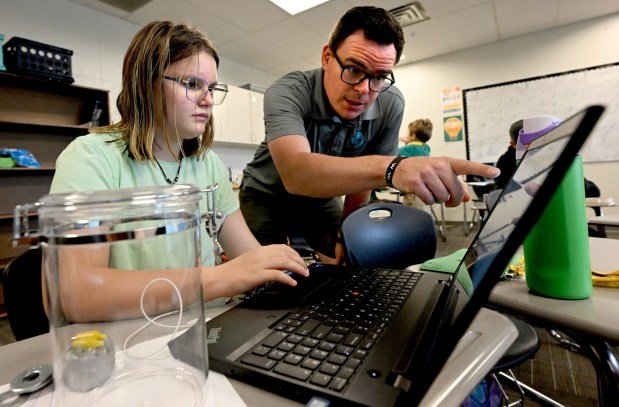 Natalia Schwening, left, gets help from teacher Nathan Wilcox during Thursday's "Creative Technology for Good" camp at Timberline PK-8 in Longmont. (Cliff Grassmick/Staff Photographer)