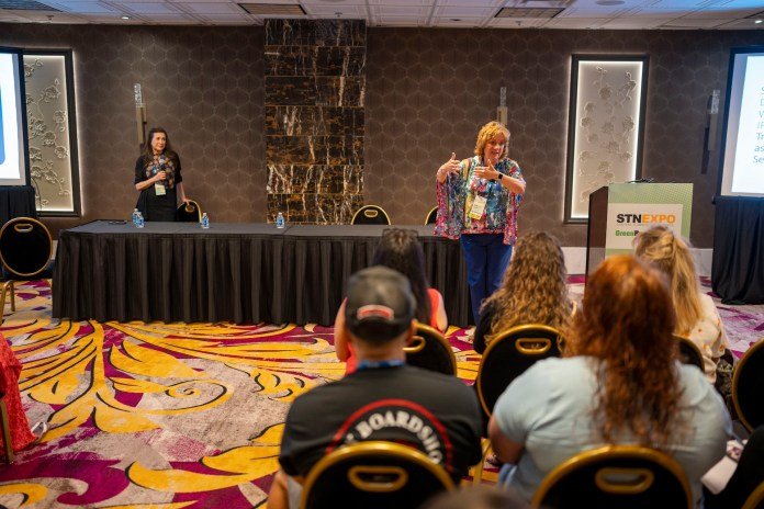 From left: Denise Donaldson, the editor and publisher of Safe Ride News Publications, and Sue Shutrump, at the time the supervisor of OT/PT services for Trumbull County Educational Service Center in Ohio, discuss the importance of CSRS during STN EXPO Reno on July 14, 2024. (Photo courtesy of Vincent Rios Creative.)