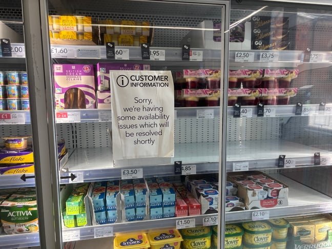 May 2025: A Co-op store in Manchester warns of food availability issues on half-stocked shelves