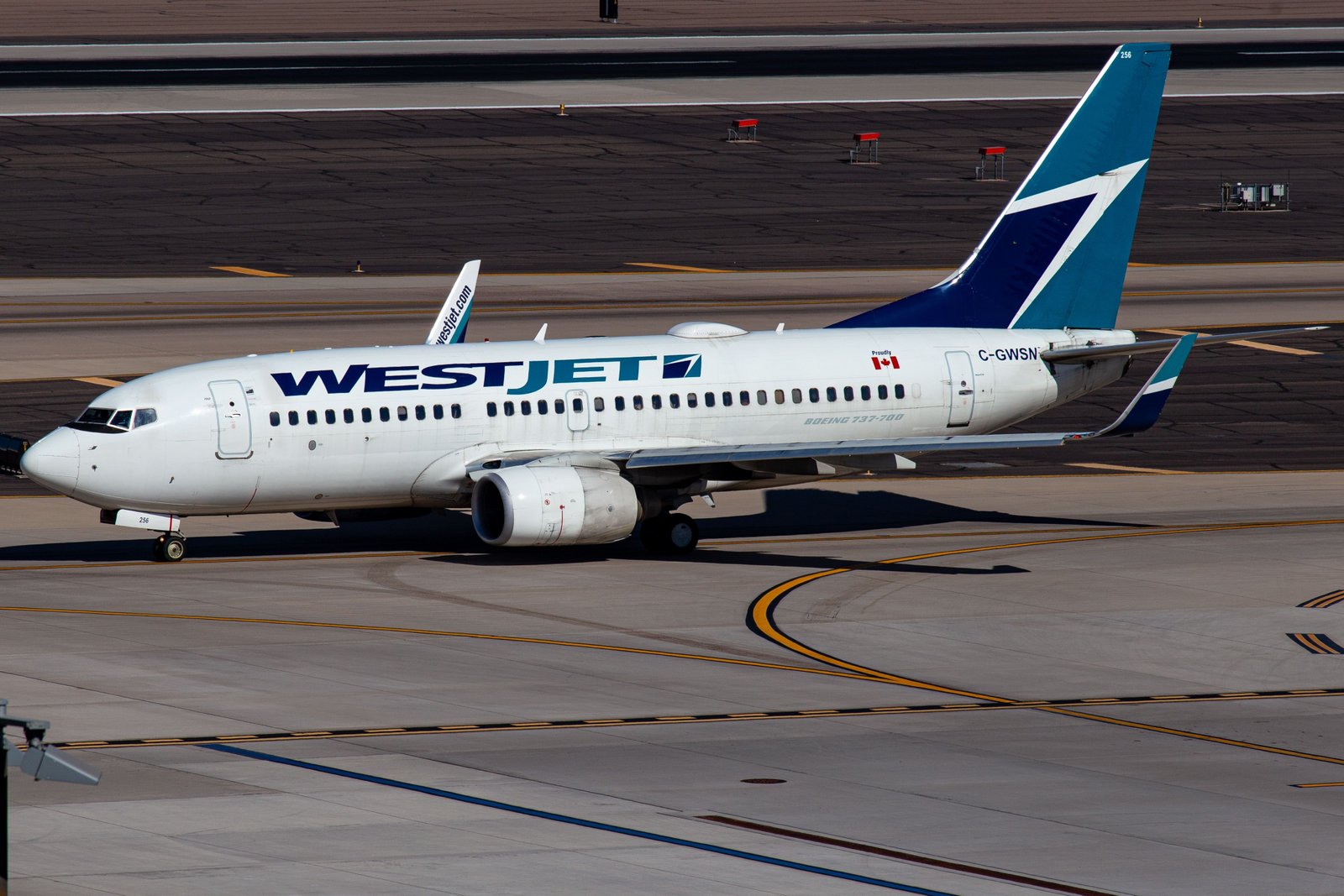 WestJet Boeing 737-700 taxiing at Phoenix Sky Harbor International Airport PHX