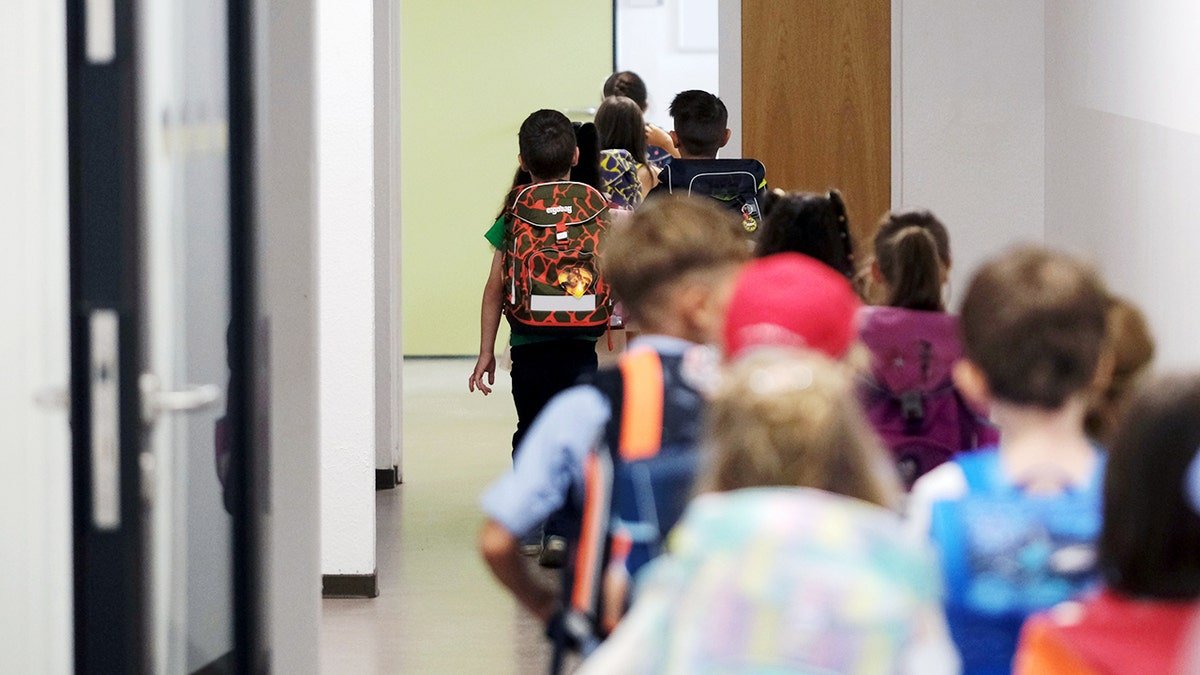 Students walking down the hall.