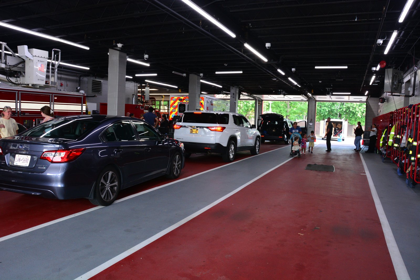 Cars line up for a safety seat inspection during an event hosted by state Sen. Martinez on July 26, 2025 in Deer Park.