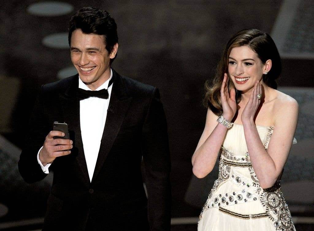 James Franco and Anne Hathaway speak onstage during the 83rd Annual Academy Awards held