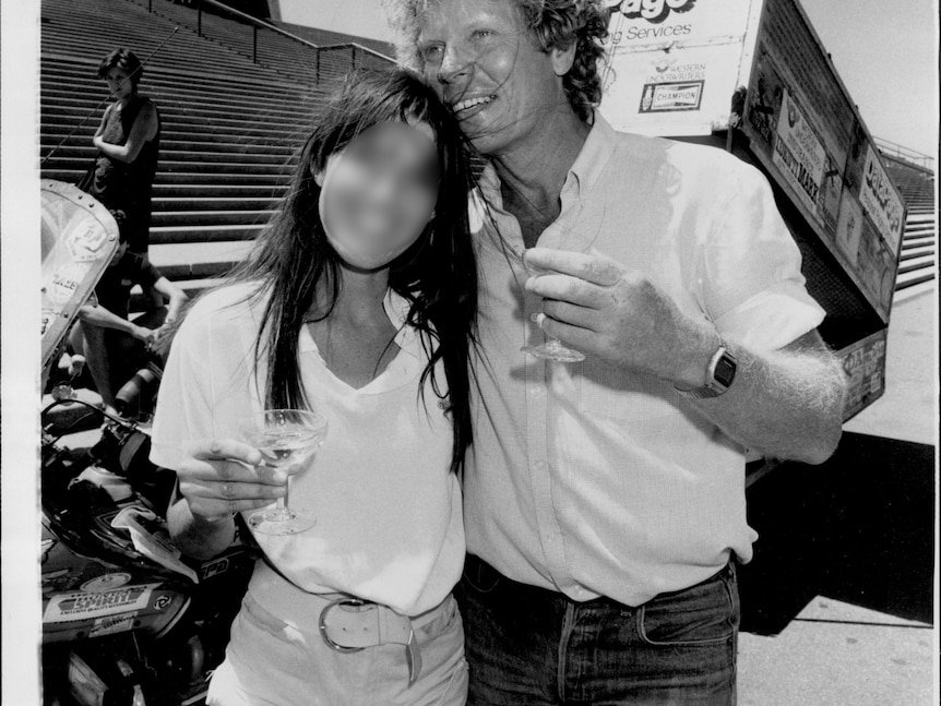 Archival photo of a man and a woman on the steps of the Sydney Opera House.