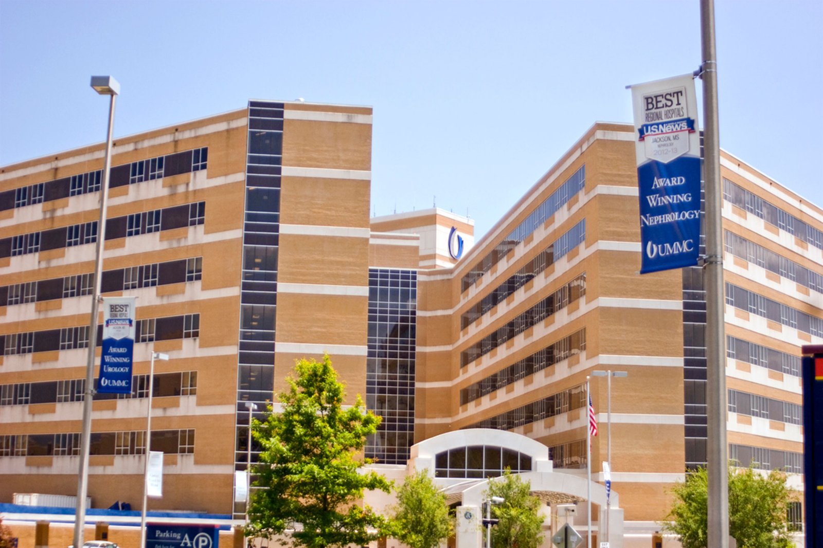 An exterior view of the UMMC hospital campus with multistory brown and white brick buildings